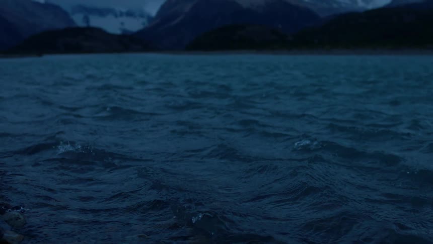 Water ripples and flows on a mountain lake