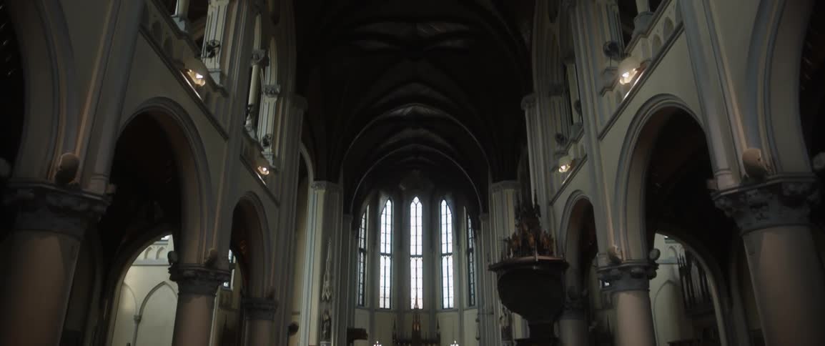People are near the altar in the church