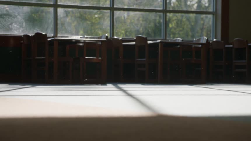 A man walks past the long window