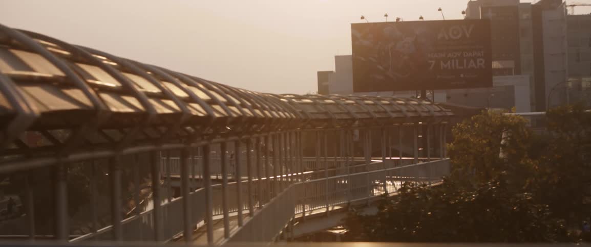 The walkway leads to buildings ahead