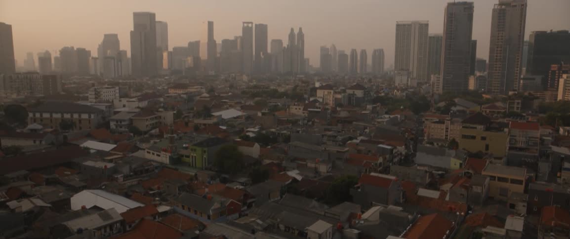 The town below is quiet before the city
