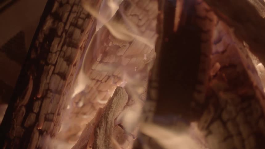 A fire consumes logs