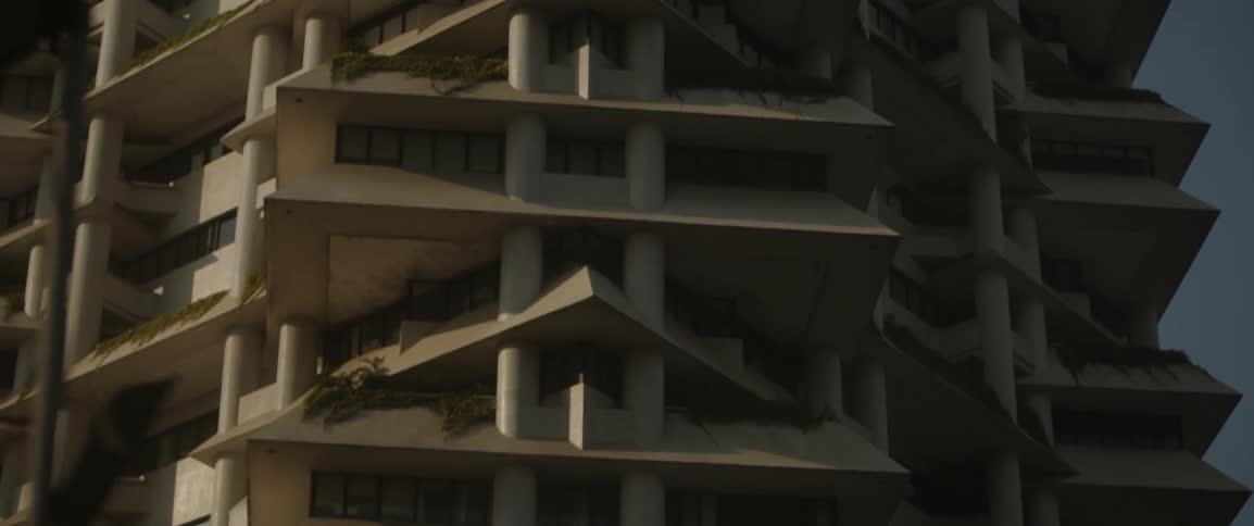 The building is tall with many terraces