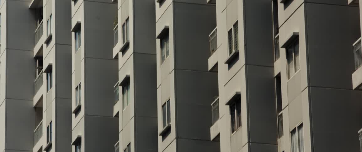Windows cover a tall apartment building