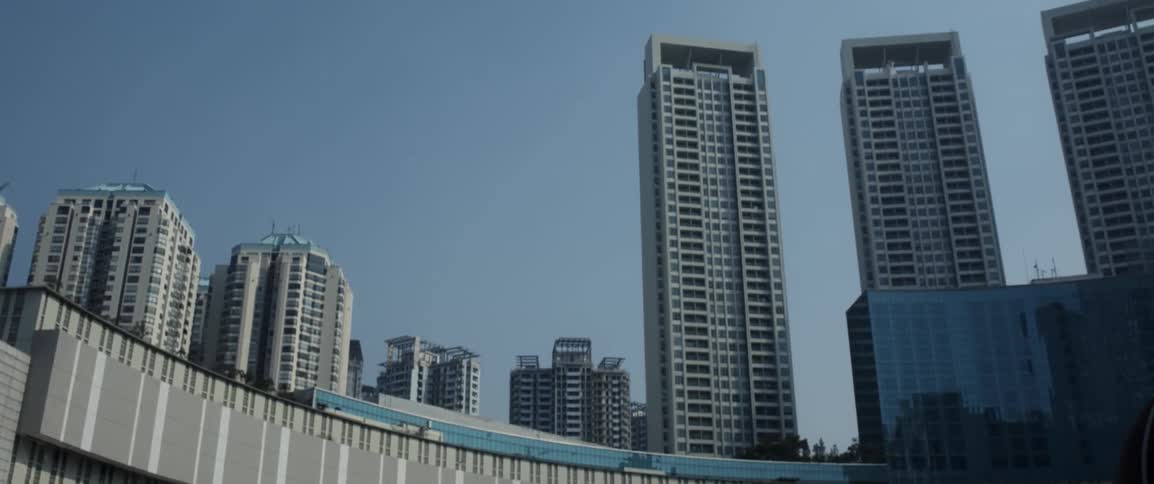 The trall buildings fill the clear sky