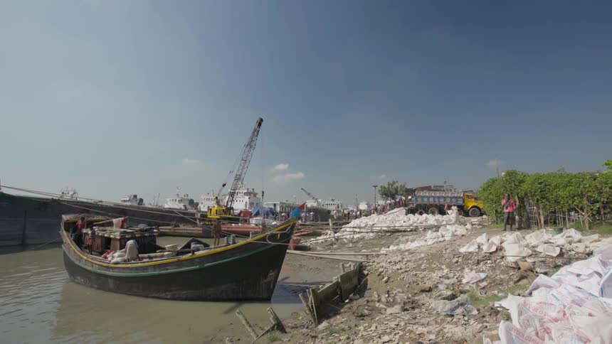A boat floats outside on a clear day