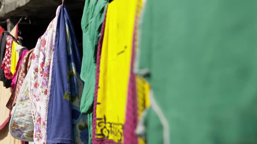 Colorful blankets and sheets hanging on a clothesline