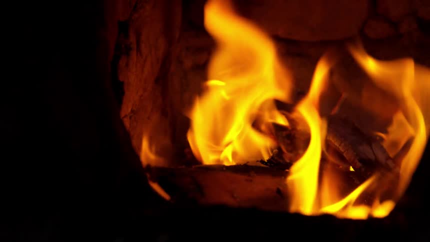 A fire burns in a kiln