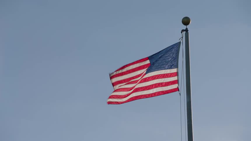 An American flag flies atop a flagpole