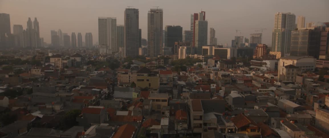 The city ahead is covered with many buildings on a cloudy day