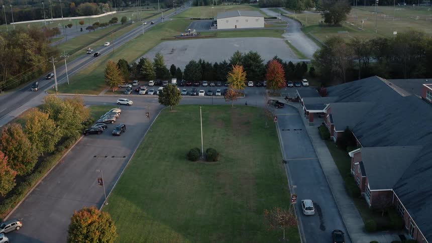 Cars make turns on a road below