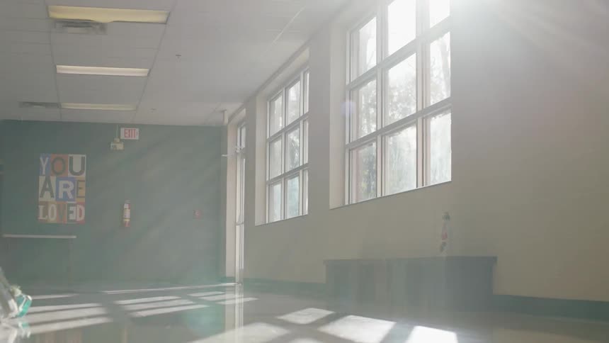 The sun shines through school windows