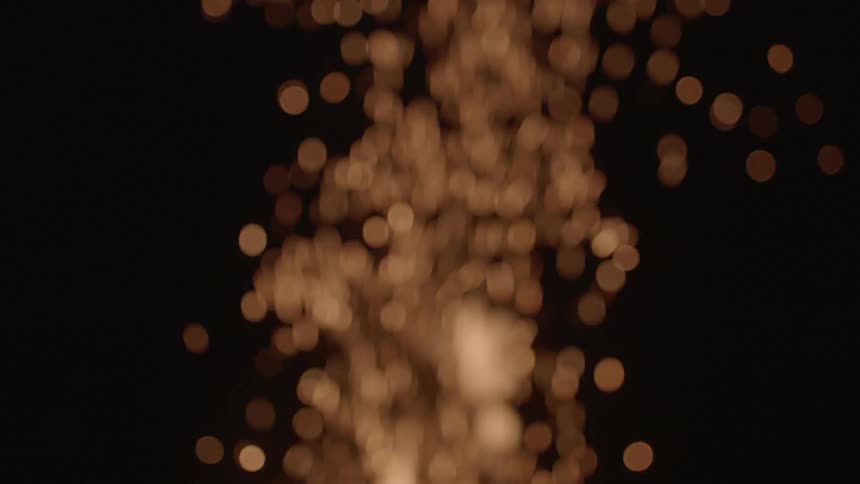 Fire sparks disappearing into the night