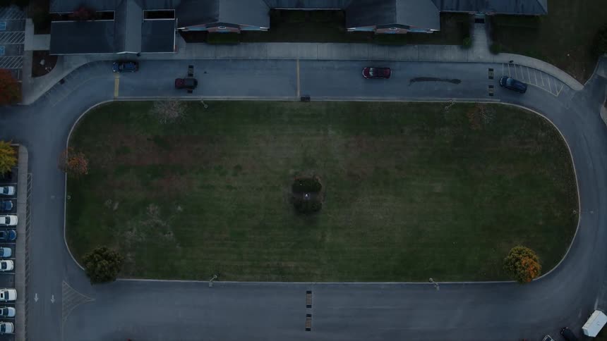 View of a small field with a road surrounding it