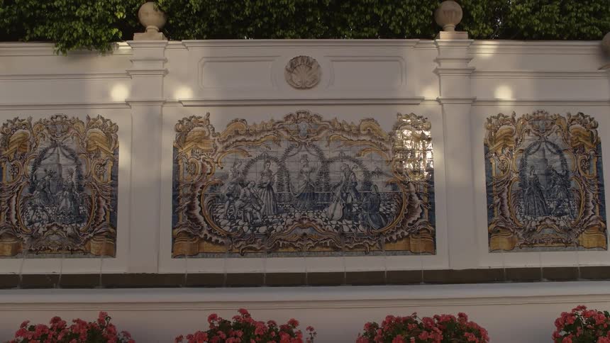 Painted murals cover an outdoor wall