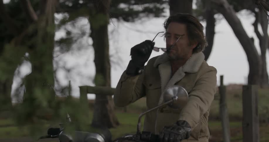 A man gets ready to start his motorcycle