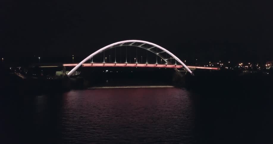 The bridge is brightly lit at night