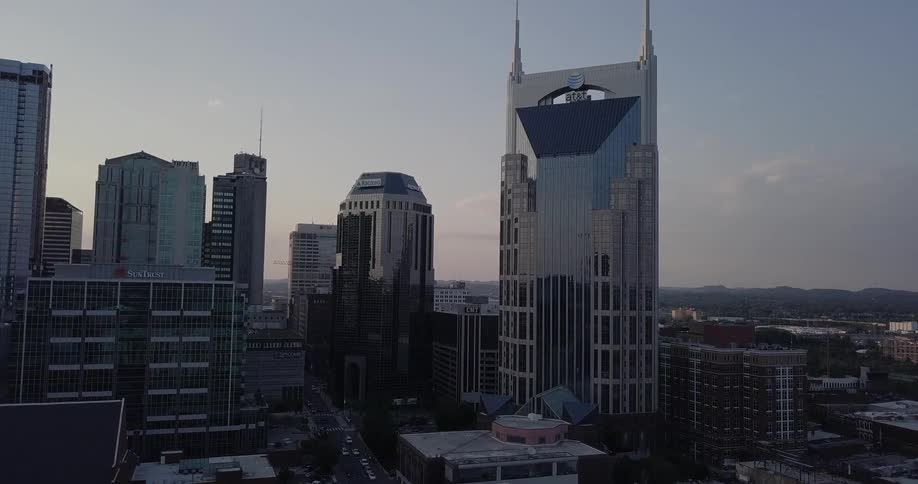 A very tall building sits on the side of a city