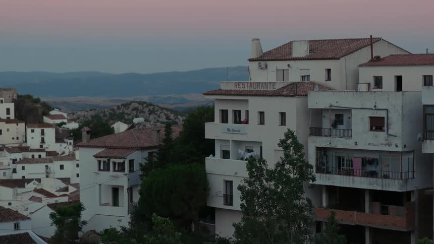Buildings are shown at sunset