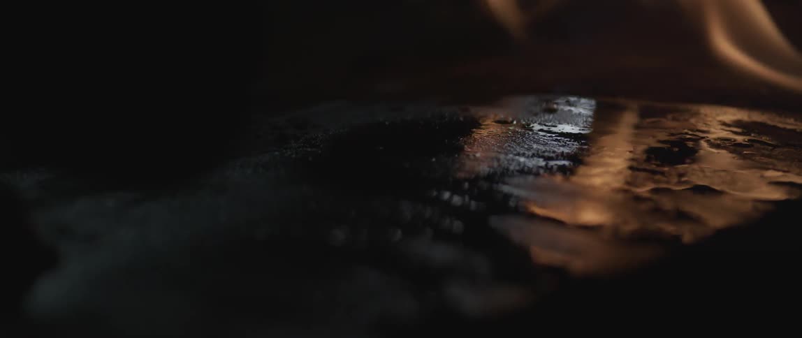 Close up video of a skateboard thats on fire