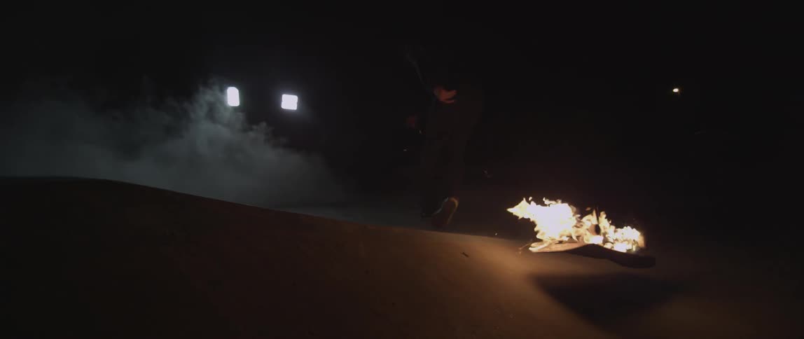 Someone falls off of a burning skateboard