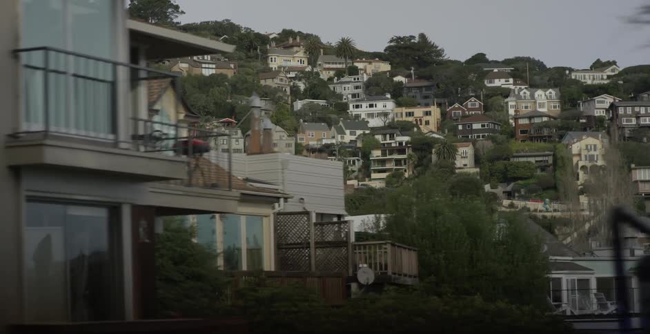 There are many houses on the hill ahead