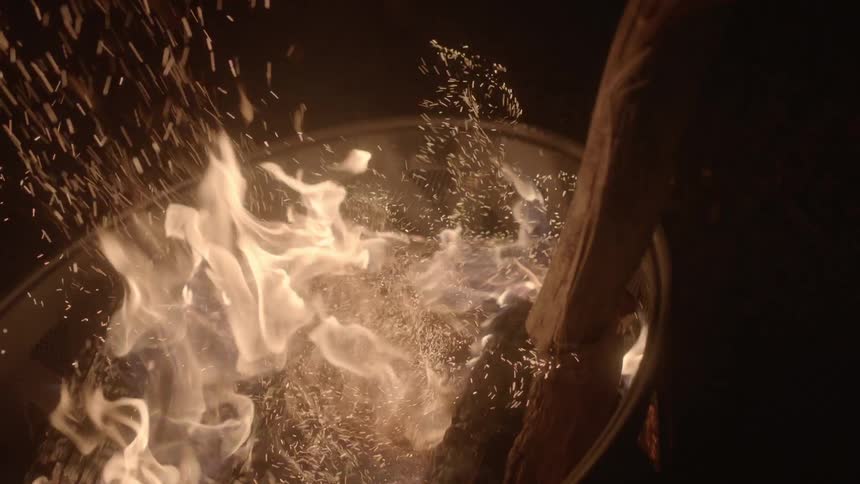 A fire burns in a fire pit