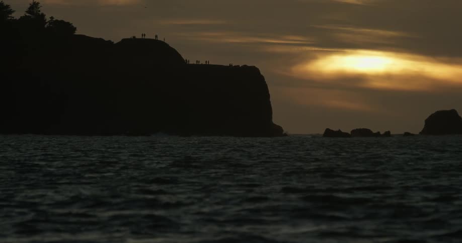 The water is rough by this cliff