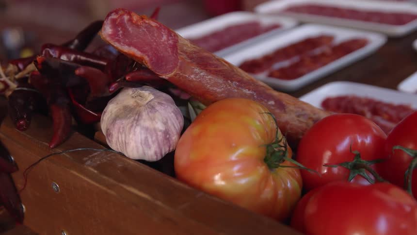 The table is covered with foods