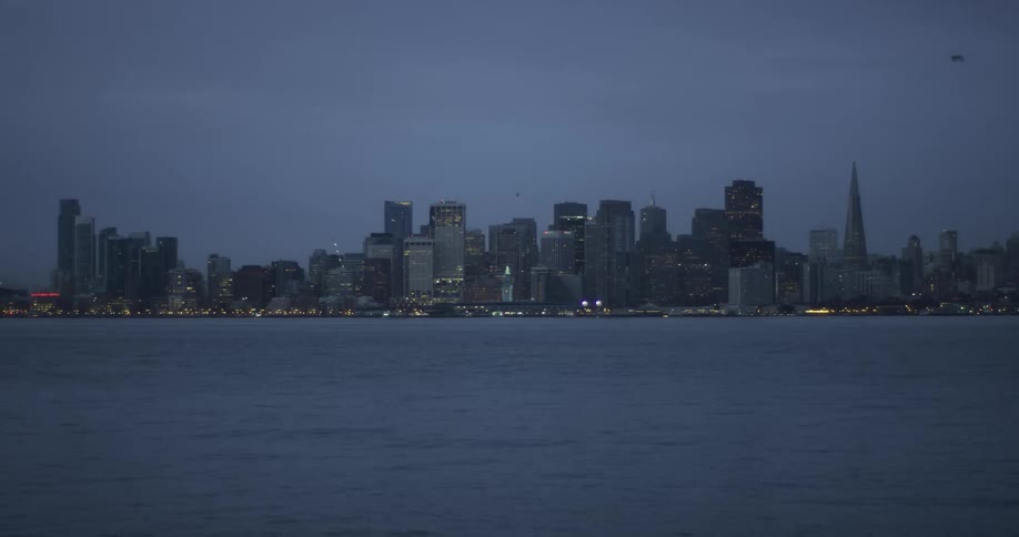 A city skyline is taken at dusk