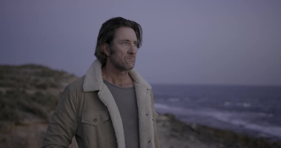 A man looks out at the ocean