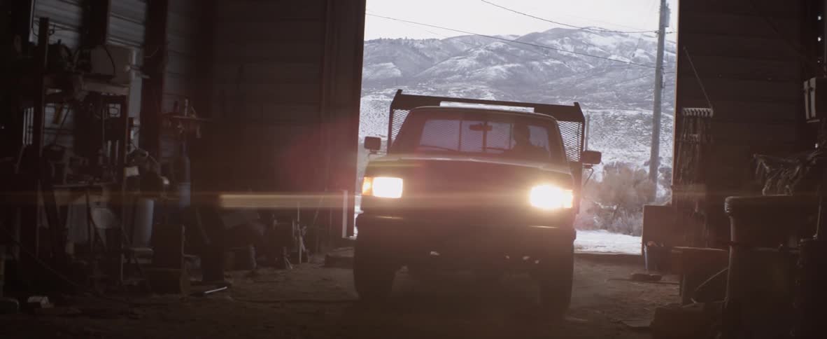 Truck drives into a large garage in the country