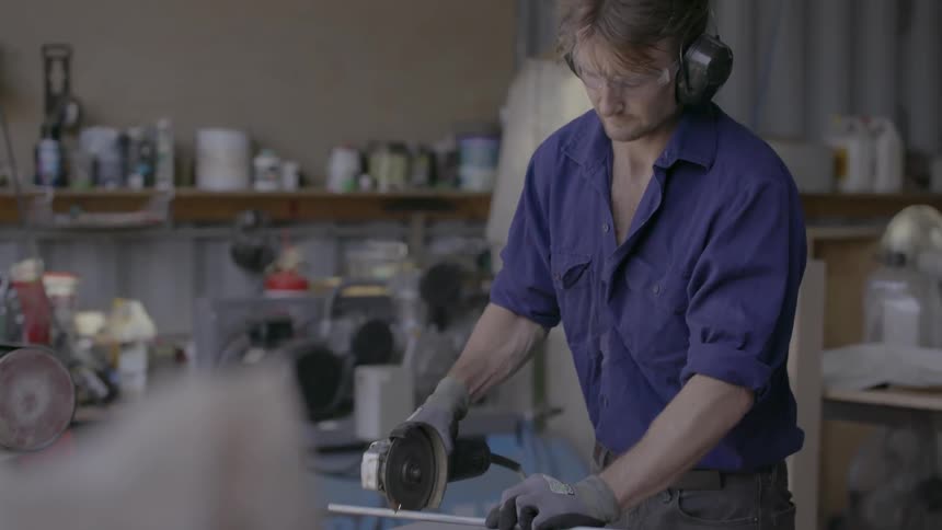 A man is working in a shop