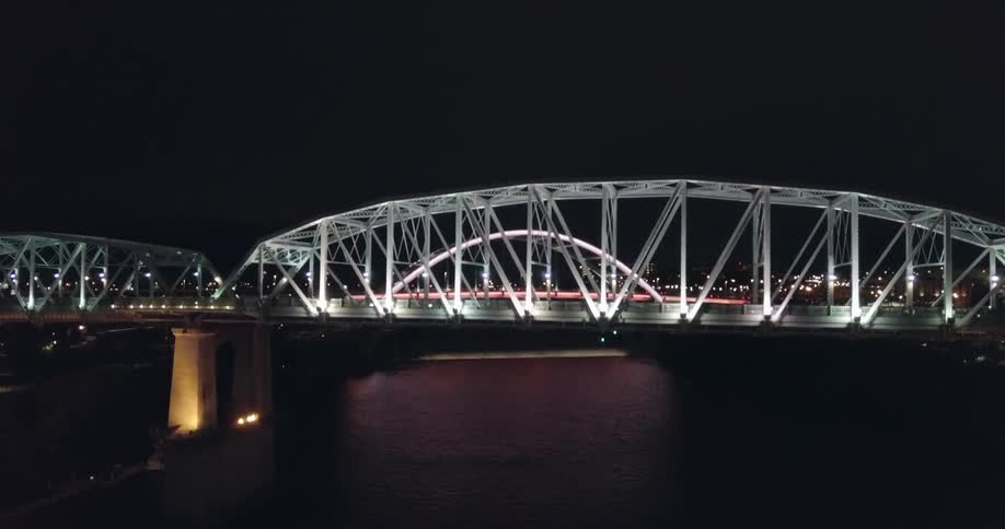 A view of two city bridges at night
