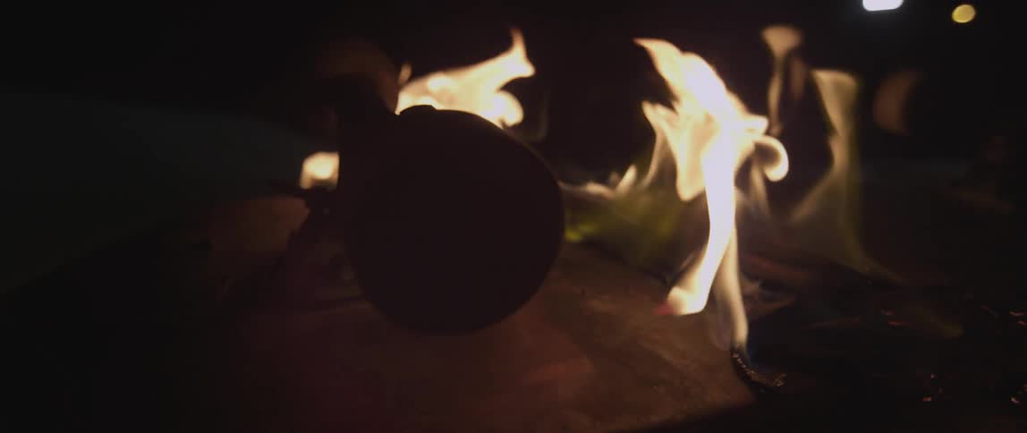 A skateboard is being filmed on fire