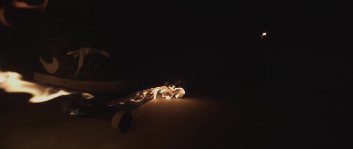 A person on a flaming skateboard