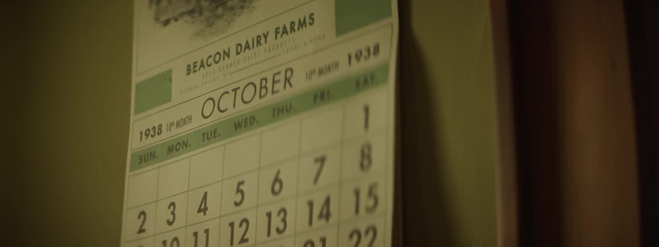 An old 1938 dairy farm calendar hangs on the wall
