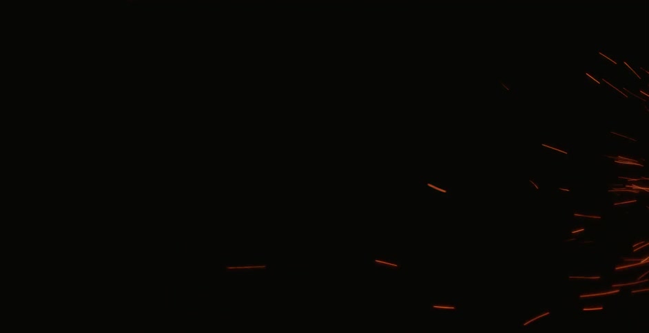 Sparks fly in the night sky