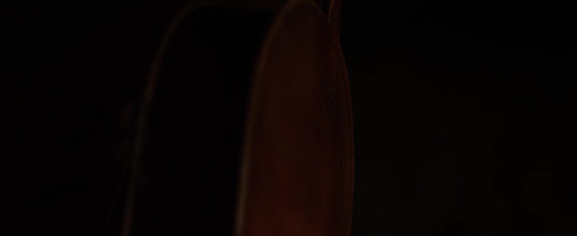 A violin is turned in the dark