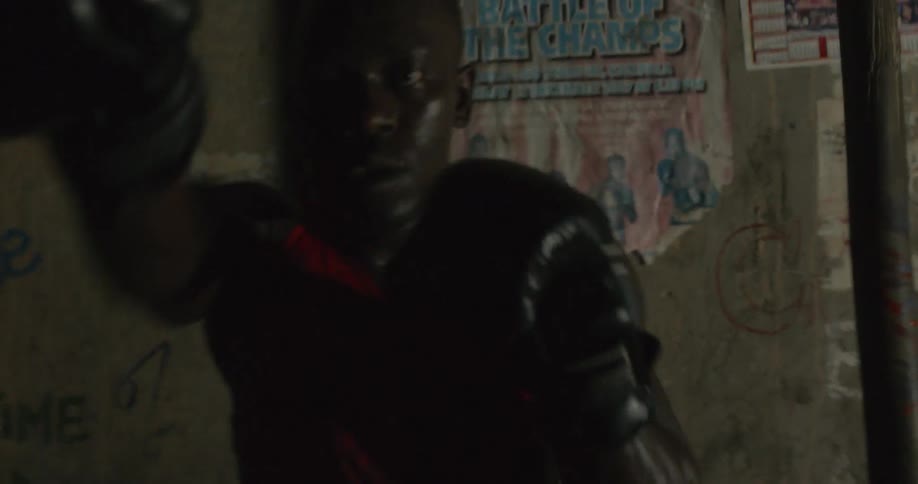 A man is shadow boxing vigorously
