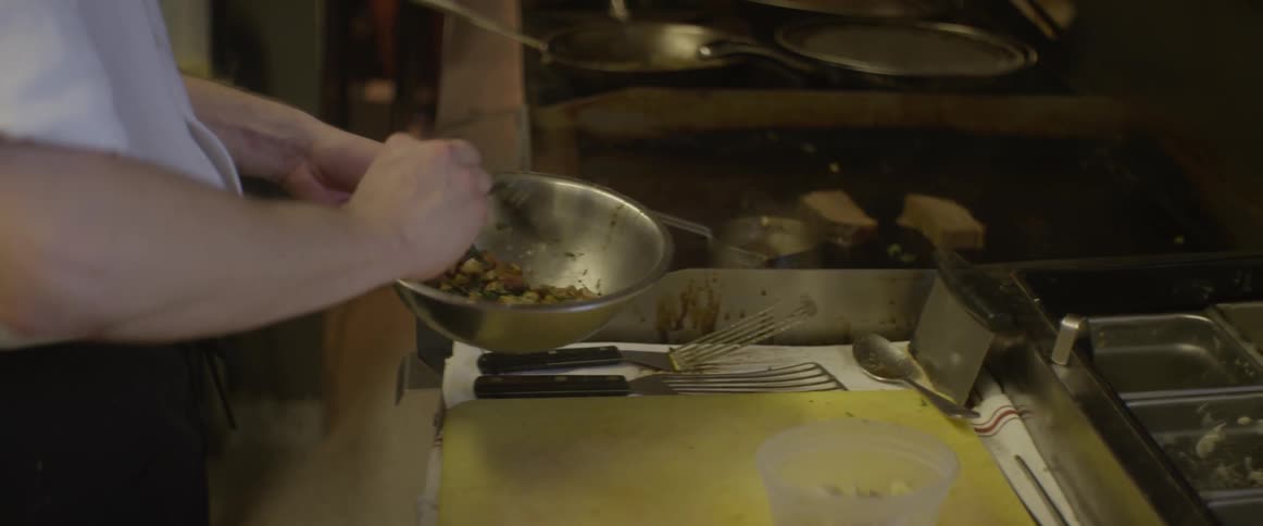 A person is preparing food in a kitchen