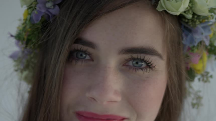 A woman turns and smiles