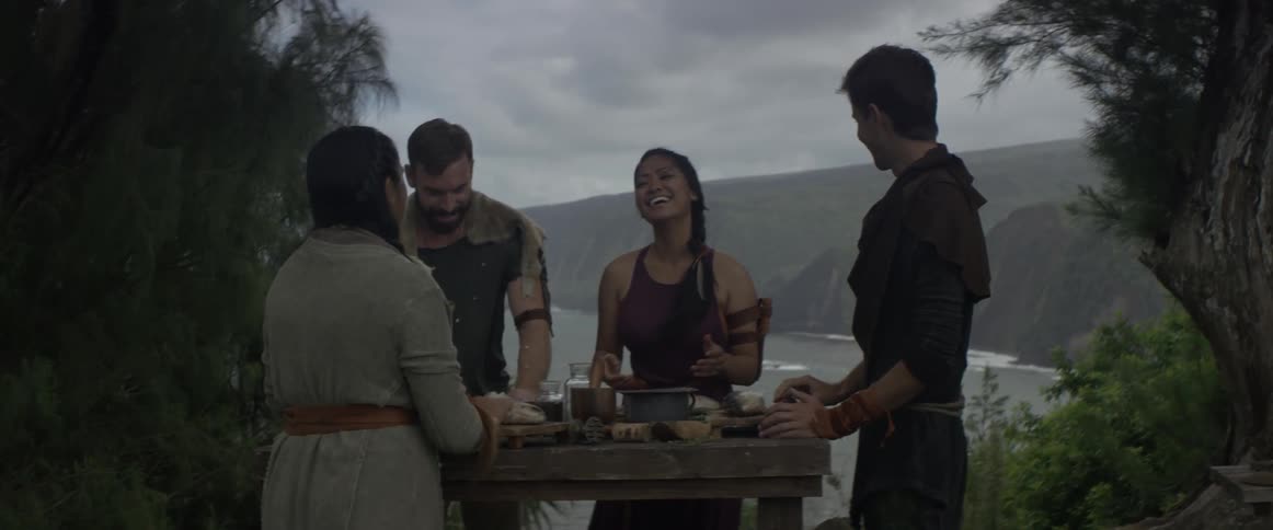A family has fun preparing dinner outdoors