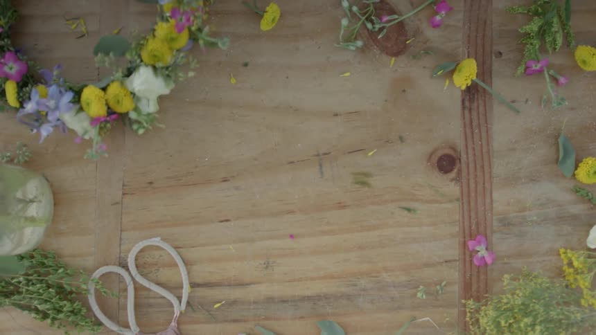 Flowers are being arranged on a board