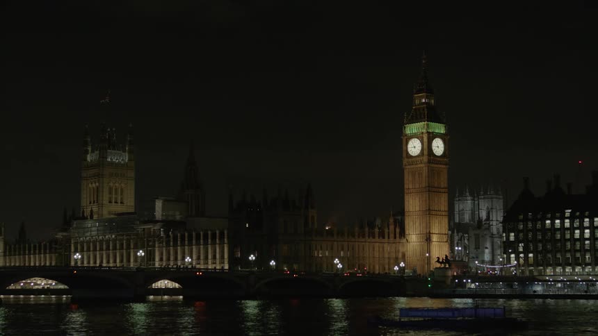 Big ben is filmed from the waterfront in London
