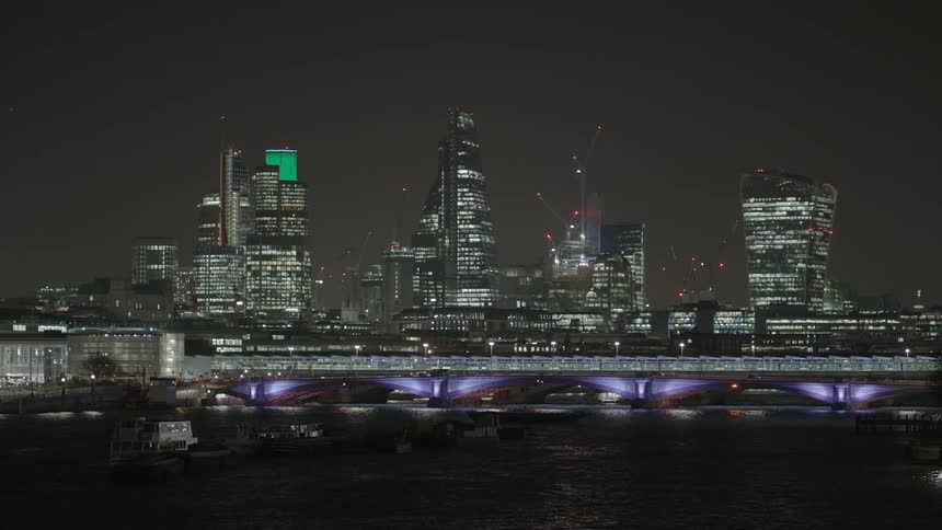 The city over the water has very tall buildings