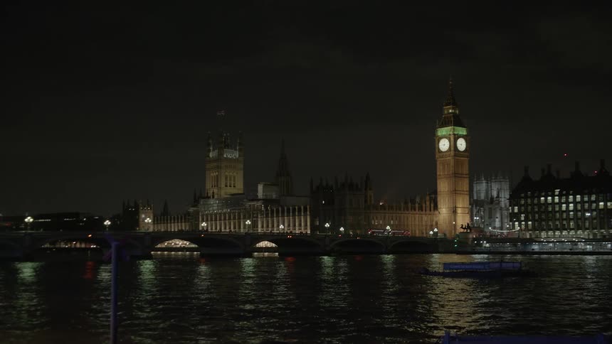 A clock tower is part of the city of bright lights