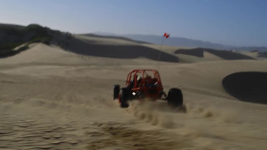 Vehicles are racing in the desert