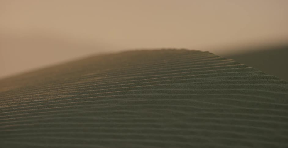Sand dunes are being filmed in the morning sun