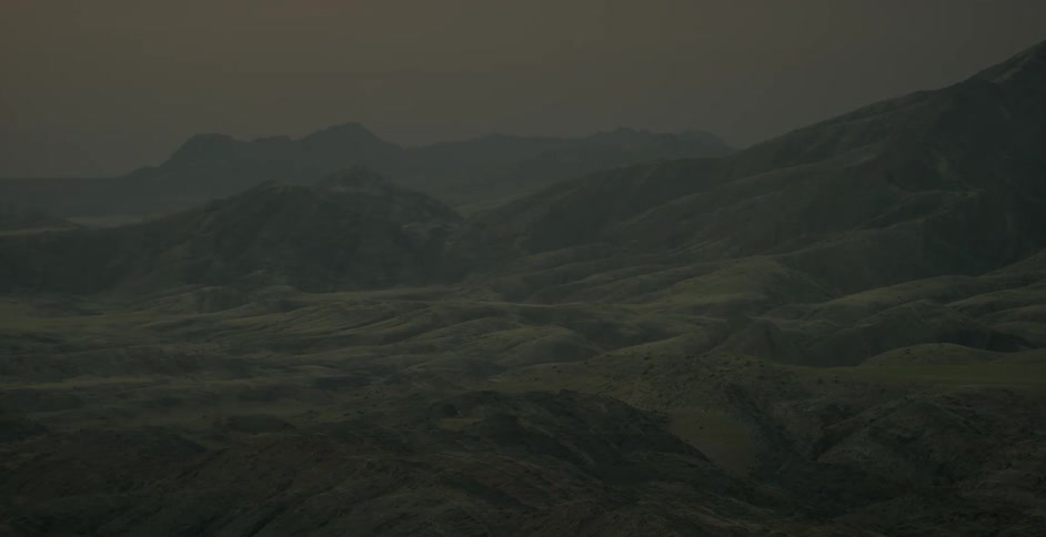A valley and mountains are being filmed